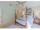 Bedroom boasts a vaulted ceiling, ceiling fan, and a view of the en suite bathroom at 0317 Glen Echo Ln # C, Cary, NC 27518