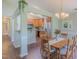 Bright dining area adjacent to the kitchen with skylight and wood floors at 0317 Glen Echo Ln # C, Cary, NC 27518