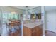 Open dining area with wood floors, stylish chandelier, and sliding glass doors to the outside at 0317 Glen Echo Ln # C, Cary, NC 27518