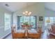 Dining room with wood table and chairs near sliding glass doors and hardwood floors at 0317 Glen Echo Ln # C, Cary, NC 27518