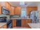 Well-equipped kitchen featuring stainless steel appliances, granite countertops, and ample cabinetry at 0317 Glen Echo Ln # C, Cary, NC 27518