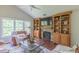 Comfortable living room with stone fireplace, built-ins, and natural light at 0317 Glen Echo Ln # C, Cary, NC 27518