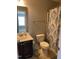 Bathroom with a vanity, toilet, and shower with a decorative shower curtain at 109 E Webber Lane Ln, Clayton, NC 27527