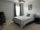 Comfortable bedroom featuring natural light, a ceiling fan, and a patterned bedspread at 109 E Webber Lane Ln, Clayton, NC 27527