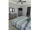 Comfortable bedroom with a ceiling fan, dresser, and stylish bedspread at 109 E Webber Lane Ln, Clayton, NC 27527