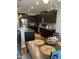 Well-appointed kitchen featuring dark cabinetry, granite countertops, and stainless steel appliances at 109 E Webber Lane Ln, Clayton, NC 27527