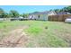 View of the large backyard with a deck and above ground pool with the house and fence surrounding at 111 Marshay Meadow Rd, Youngsville, NC 27596