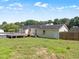 Expansive backyard view showcasing well-kept lawn and the home's exterior at 111 Marshay Meadow Rd, Youngsville, NC 27596