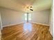 Bedroom featuring hardwood floors, a ceiling fan, and natural light from two windows at 111 Marshay Meadow Rd, Youngsville, NC 27596