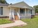Charming home with a welcoming covered front porch and a well-maintained exterior at 111 Marshay Meadow Rd, Youngsville, NC 27596