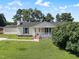 Charming single-story home with a well-maintained lawn, covered porch, and basketball court at 111 Marshay Meadow Rd, Youngsville, NC 27596
