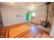 Open living room features wood-burning fireplace and unique wood flooring at 111 Marshay Meadow Rd, Youngsville, NC 27596