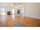 Spacious living room featuring unique wood floors, a fireplace, and abundant natural light at 111 Marshay Meadow Rd, Youngsville, NC 27596