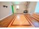 Bright living room featuring a wood-burning stove and beautiful hardwood floors at 111 Marshay Meadow Rd, Youngsville, NC 27596