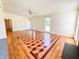 Bright and airy living room featuring unique wood floors and lots of natural light at 111 Marshay Meadow Rd, Youngsville, NC 27596