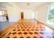 Open-concept living area featuring beautiful parquet floors, ceiling fan and lots of natural light at 111 Marshay Meadow Rd, Youngsville, NC 27596
