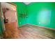 This office features laminate wood flooring and access to another room at 111 Marshay Meadow Rd, Youngsville, NC 27596