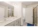 Bathroom features double sinks, a large mirror, and a tiled shower with glass doors at 1137 Amber Shadow Dr, Durham, NC 27703