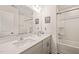 A modern bathroom featuring dual sinks, a large mirror, and a combined shower and bathtub at 1137 Amber Shadow Dr, Durham, NC 27703