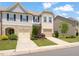 Charming townhome featuring a two-car garage, well-manicured lawn, and inviting curb appeal in a desirable neighborhood at 1137 Amber Shadow Dr, Durham, NC 27703