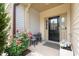 Cozy front porch with seating, flowers, and a welcoming entryway at 1137 Amber Shadow Dr, Durham, NC 27703