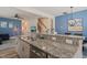 Eat-in kitchen features granite countertops, modern appliances and breakfast bar at 1137 Amber Shadow Dr, Durham, NC 27703