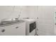 A well-lit laundry room with modern, front-loading Maytag washer and dryer units at 1137 Amber Shadow Dr, Durham, NC 27703