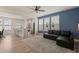 Living room open to kitchen and dining area with generous natural light and open floorplan at 1137 Amber Shadow Dr, Durham, NC 27703