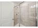 Bathroom shower with glass doors and decorative tile at 1137 Amber Shadow Dr, Durham, NC 27703