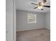 Bedroom featuring carpet flooring, a ceiling fan, and a window providing natural light at 117 Scott Ln, Chapel Hill, NC 27514