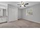 Neutral bedroom with ceiling fan, carpet, and natural light from window at 117 Scott Ln, Chapel Hill, NC 27514