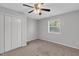 Bedroom with neutral carpet, ceiling fan, and a window providing ample natural light at 117 Scott Ln, Chapel Hill, NC 27514