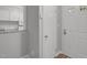 Condo entryway with gray walls, white trim, and a view of the kitchen at 117 Scott Ln, Chapel Hill, NC 27514