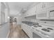 View of the kitchen showing granite countertops and leading into the living room at 117 Scott Ln, Chapel Hill, NC 27514