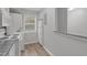 Bright kitchen with a window, appliances, and updated gray paint at 117 Scott Ln, Chapel Hill, NC 27514