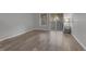 Living room featuring wood-style floors, with a patio door and window for natural light at 117 Scott Ln, Chapel Hill, NC 27514