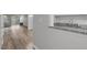 View of condo living room with laminate floors from the kitchen bar at 117 Scott Ln, Chapel Hill, NC 27514