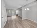 Bright living room with wood-look floors and sliding glass doors to the exterior at 117 Scott Ln, Chapel Hill, NC 27514