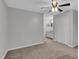 Spacious main bedroom with carpet flooring, ceiling fan, large closet, and an ensuite bathroom at 117 Scott Ln, Chapel Hill, NC 27514