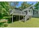 Exterior steps leading up to the back deck of a one-story home, supported by wooden beams at 1205 Hillsborough Rd, Chapel Hill, NC 27516