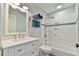 Updated bathroom featuring a bright white vanity, subway tile surround and modern fixtures at 1205 Hillsborough Rd, Chapel Hill, NC 27516