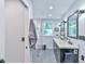 Sleek modern bathroom with dual vanity, glass shower, and contemporary fixtures at 1205 Hillsborough Rd, Chapel Hill, NC 27516