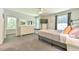 Bright bedroom with large windows, a dresser, and a plush bench seat beneath a sunny window at 1205 Hillsborough Rd, Chapel Hill, NC 27516
