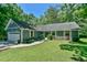 Inviting home with beautiful landscaping, flower boxes, and a charming entrance at 1205 Hillsborough Rd, Chapel Hill, NC 27516