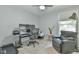 Functional home office featuring modern desk setup, comfortable seating and natural light at 1205 Hillsborough Rd, Chapel Hill, NC 27516