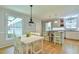 Bright and airy kitchen with a large island, modern lighting, and hardwood floors at 1205 Hillsborough Rd, Chapel Hill, NC 27516