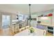 Modern kitchen featuring stainless steel appliances, an island with seating, and hardwood floors at 1205 Hillsborough Rd, Chapel Hill, NC 27516