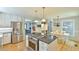 Spacious kitchen with an island cooktop, stainless steel appliances, and open layout at 1205 Hillsborough Rd, Chapel Hill, NC 27516