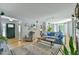 Spacious living room with stylish decor and seamless flow from entryway to kitchen area at 1205 Hillsborough Rd, Chapel Hill, NC 27516