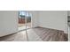 Bright living area with stylish wood flooring and sliding glass doors to the outdoor patio at 1240 Pond Overlook, Nashville, NC 27856